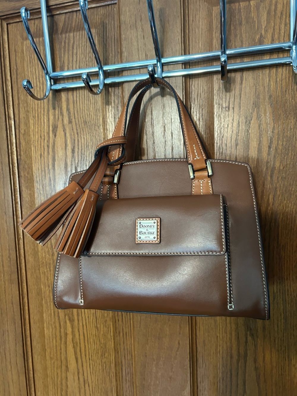 Dooney & Bourke Brown Leather Satchel with Tassel Accents